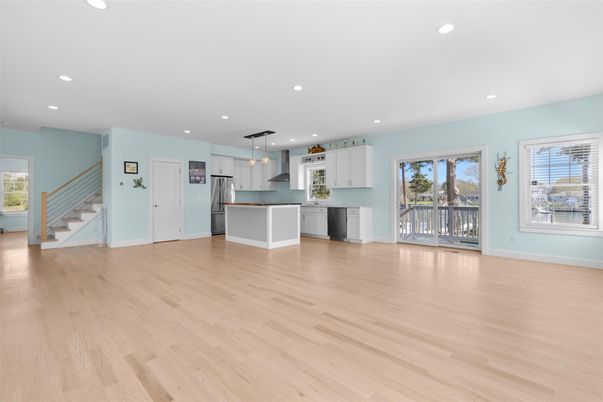 Empty room, Interior, Kitchen, Pendant Lights, Recessed Lighting, Stainless Steel Appliances, Wood Texture Flooring