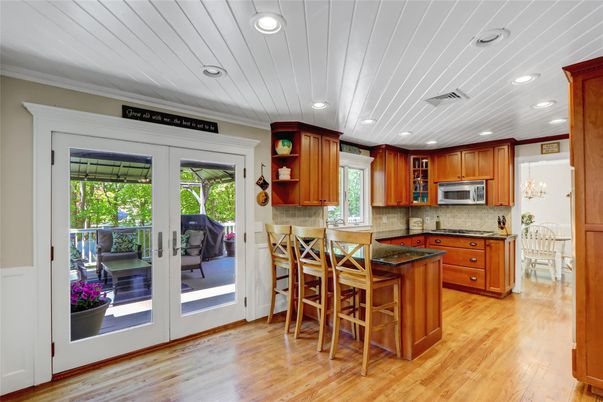 Chandelier, Dining room, Interior, Kitchen, Recessed Lighting, Stainless Steel Appliances, Wood Texture Flooring