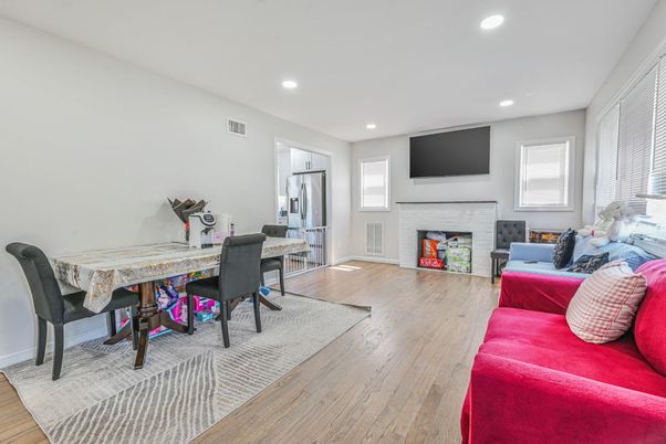 Dining room, Fireplace, Interior, Living room, Recessed Lighting, Wood Texture Flooring