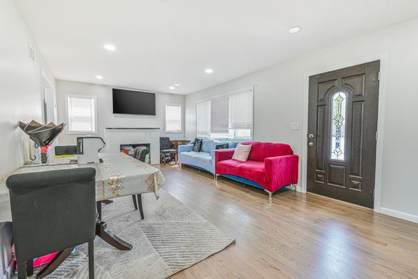 Fireplace, Fitness Equipment, Interior, Living room, Recessed Lighting, Wood Texture Flooring