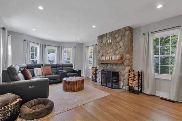 Fireplace, Interior, Living room, Recessed Lighting, Stone Walls, Wood Texture Flooring
