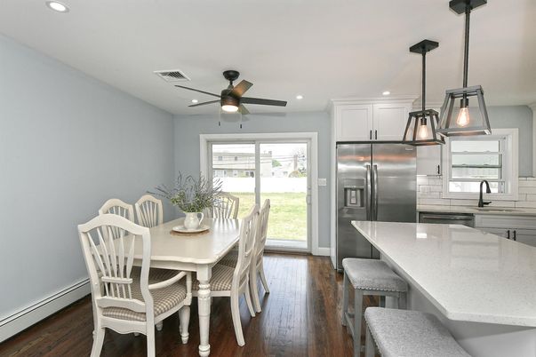 Dining room, Interior, Kitchen, Pendant Lights, Recessed Lighting, Stainless Steel Appliances, Wood Texture Flooring