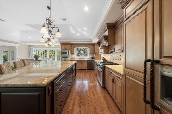 Chandelier, Dining room, Interior, Kitchen, Recessed Lighting, Stainless Steel Appliances, Wood Texture Flooring