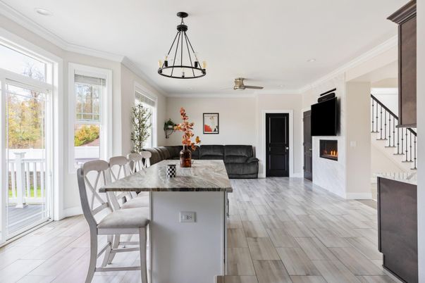 Dining room, Fireplace, Interior, Living room, Pendant Lights, Recessed Lighting, Wood Texture Flooring