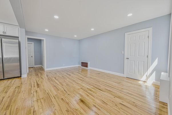 Empty room, Interior, Recessed Lighting, Stainless Steel Appliances, Wood Texture Flooring