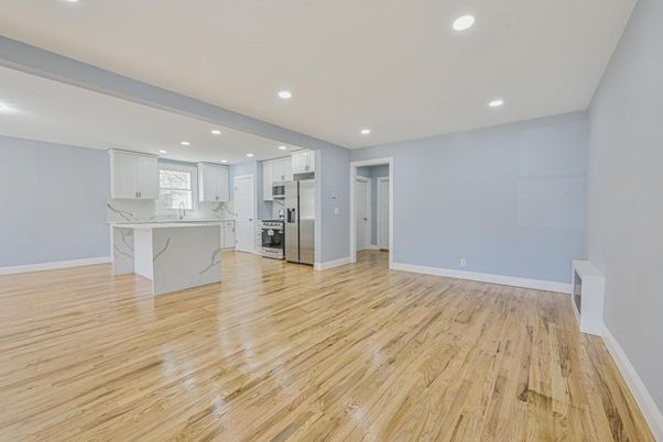 Interior, Kitchen, Marble Walls, Recessed Lighting, Stainless Steel Appliances, Wood Texture Flooring