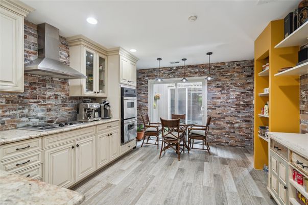 Dining room, Interior, Kitchen, Pendant Lights, Recessed Lighting, Stainless Steel Appliances, Stone Walls, Wood Texture Flooring