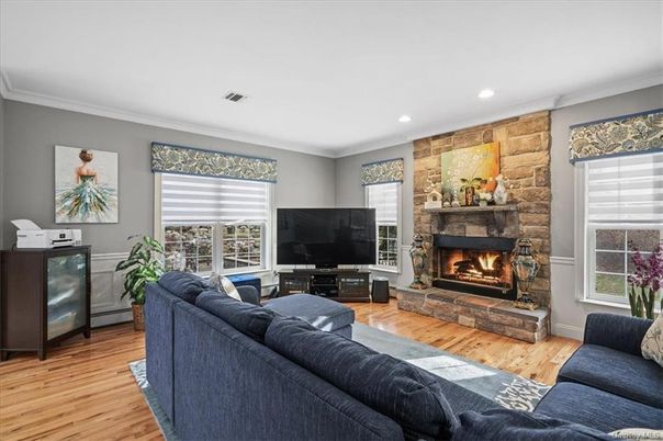 Fireplace, Interior, Living room, Recessed Lighting, Stone Walls, Wood Texture Flooring