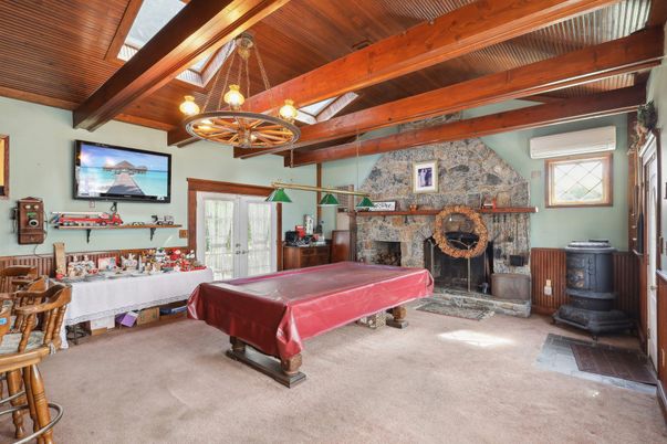 Billiard Table, Chandelier, Fireplace, Game Room, Interior, Stone Walls, Wooden Beams, Wooden Ceilings
