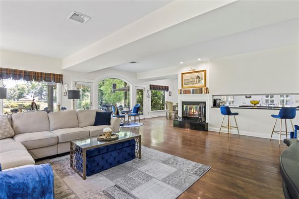 Dining room, Fireplace, Interior, Living room, Recessed Lighting, Wood Texture Flooring
