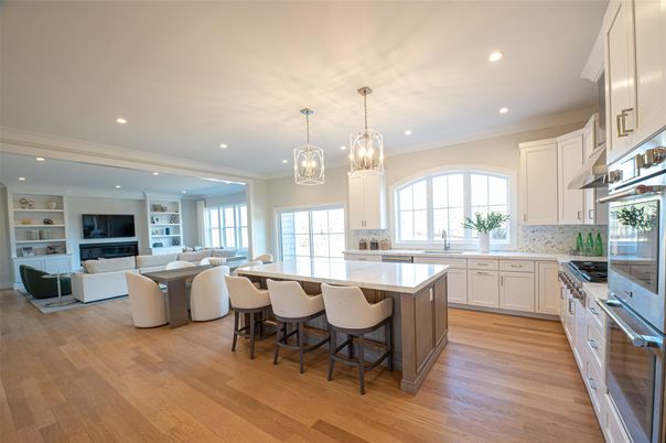 Chandelier, Dining room, Interior, Kitchen, Living room, Pendant Lights, Recessed Lighting, Stainless Steel Appliances, Wood Texture Flooring