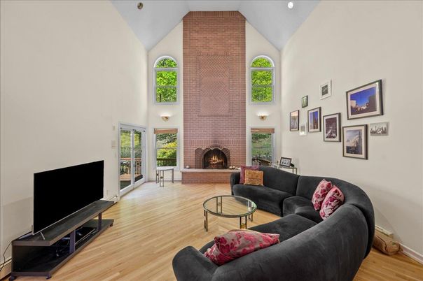 Fireplace, Interior, Living room, Recessed Lighting, Stone Walls, Wood Texture Flooring