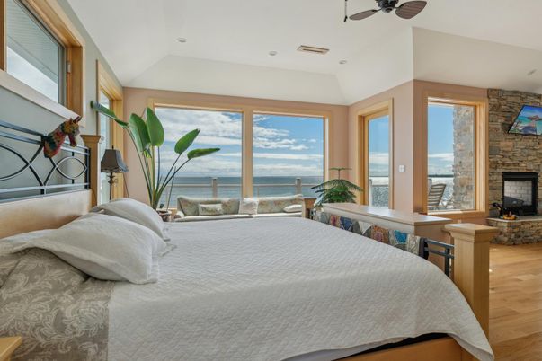 Bedroom, Fireplace, Interior, Recessed Lighting, Stone Walls, Water, Wood Texture Flooring