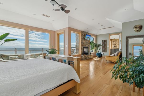 Bedroom, Fireplace, Interior, Recessed Lighting, Water, Wood Texture Flooring