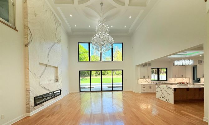 Chandelier, Fireplace, Interior, Kitchen, Marble Walls, Recessed Lighting, Wood Texture Flooring
