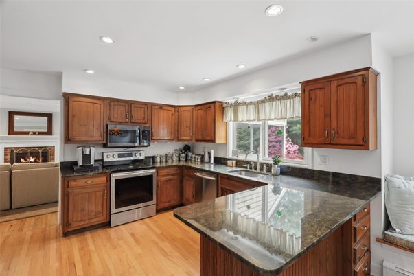 Fireplace, Interior, Kitchen, Recessed Lighting, Stainless Steel Appliances, Wood Texture Flooring