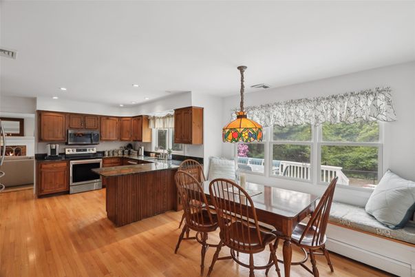 Dining room, Interior, Kitchen, Pendant Lights, Recessed Lighting, Stainless Steel Appliances, Wood Texture Flooring