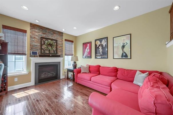 Fireplace, Interior, Living room, Recessed Lighting, Stone Walls, Wood Texture Flooring
