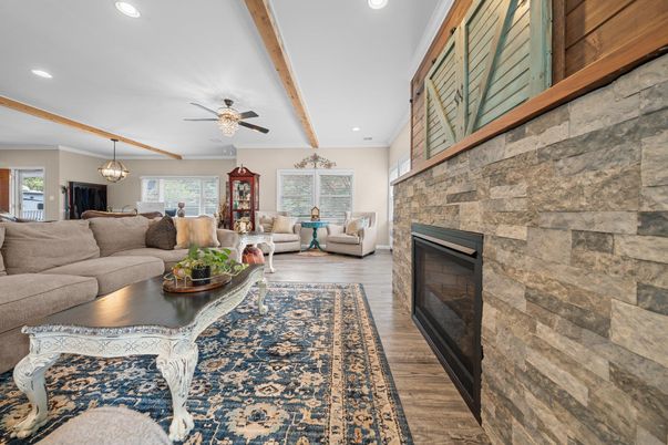 Fireplace, Interior, Living room, Pendant Lights, Recessed Lighting, Stone Walls, Wooden Beams, Wood Texture Flooring