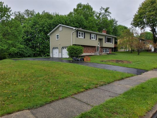 Attached, Backyard, Exterior, Facade, Brick Facade, Raised Ranch