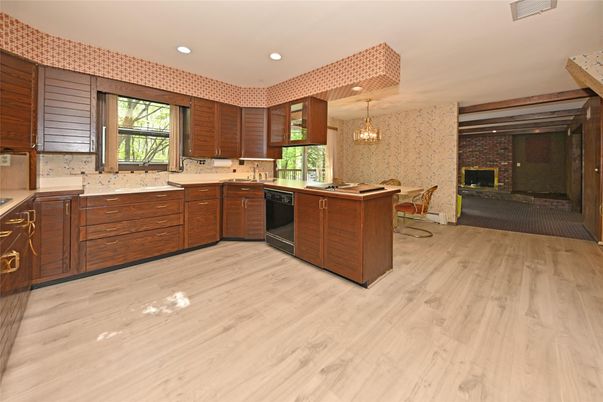Chandelier, Dining room, Fireplace, Interior, Kitchen, Pendant Lights, Recessed Lighting, Stone Walls, Wood Texture Flooring
