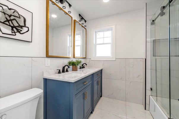 Bathroom, Dual Sink Vanities, Glass Shower, Interior, Marble, Marble Walls, Recessed Lighting