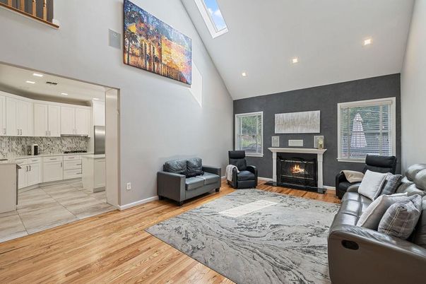Fireplace, Interior, Kitchen, Living room, Recessed Lighting, Wood Texture Flooring