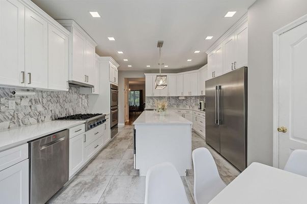 Interior, Kitchen, Marble, Marble Walls, Pendant Lights, Recessed Lighting, Stainless Steel Appliances