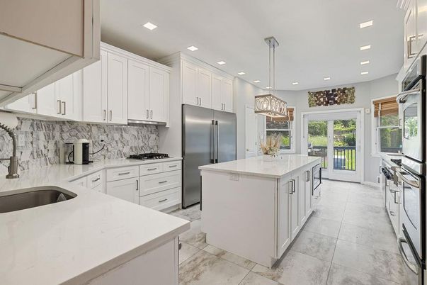 Interior, Kitchen, Marble Walls, Pendant Lights, Recessed Lighting, Stainless Steel Appliances