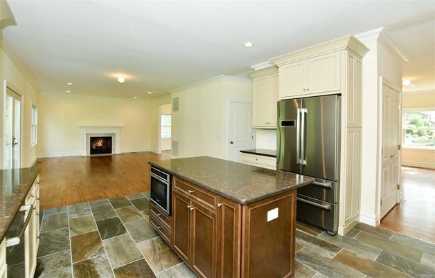 Fireplace, Interior, Kitchen, Recessed Lighting, Stainless Steel Appliances, Wood Texture Flooring