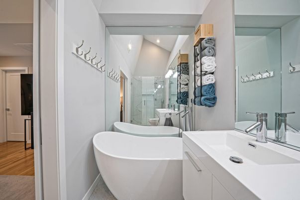 Bathroom, Dual Sink Vanities, Free Standing Baths, Glass Shower, Interior, Recessed Lighting, Wood Texture Flooring