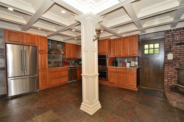 Fireplace, Interior, Kitchen, Recessed Lighting, Stainless Steel Appliances, Stone Walls