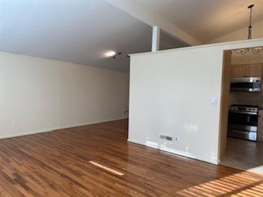 Chandelier, Empty room, Interior, Kitchen, Recessed Lighting, Stainless Steel Appliances, Wood Texture Flooring