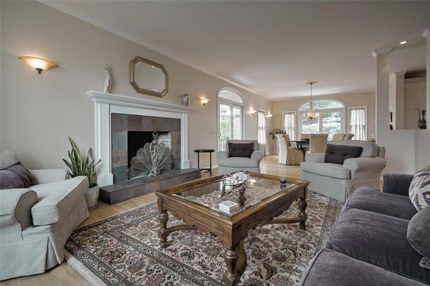 Chandelier, Dining room, Fireplace, Interior, Living room, Pendant Lights, Recessed Lighting, Wood Texture Flooring