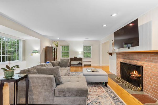 Fireplace, Interior, Living room, Recessed Lighting, Stone Walls, Wood Texture Flooring