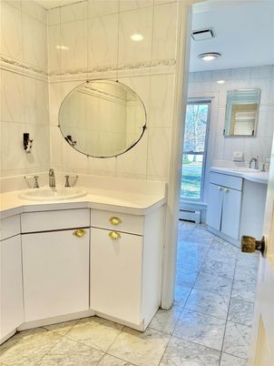 Bathroom, Dual Sink Vanities, Interior, Marble, Marble Walls, Recessed Lighting