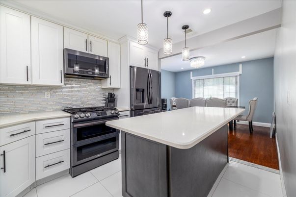 Dining room, Interior, Kitchen, Pendant Lights, Recessed Lighting, Stainless Steel Appliances, Wood Texture Flooring
