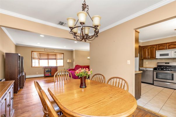 Chandelier, Dining room, Interior, Kitchen, Recessed Lighting, Stainless Steel Appliances, Wood Texture Flooring