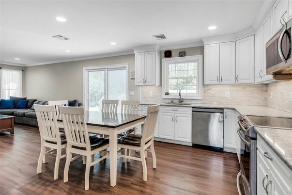 Dining room, Interior, Kitchen, Living room, Recessed Lighting, Stainless Steel Appliances, Wood Texture Flooring