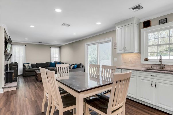 Dining room, Fireplace, Interior, Living room, Recessed Lighting, Wood Texture Flooring