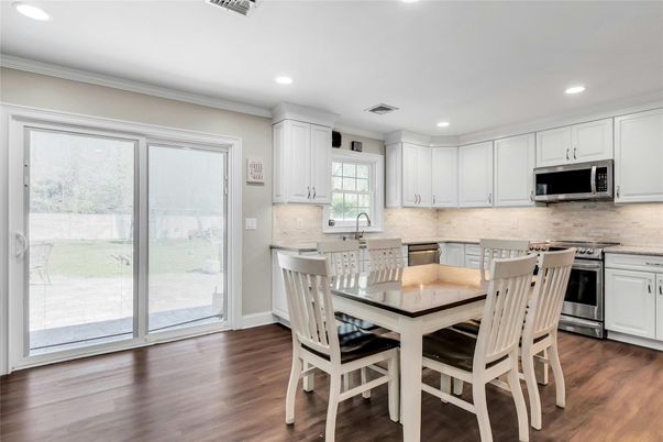 Dining room, Interior, Kitchen, Recessed Lighting, Stainless Steel Appliances, Wood Texture Flooring