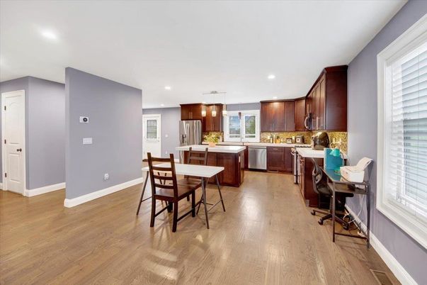 Dining room, Interior, Kitchen, Pendant Lights, Recessed Lighting, Stainless Steel Appliances, Wood Texture Flooring