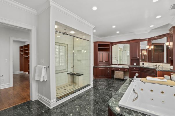 Bathroom, Dual Sink Vanities, Glass Shower, Interior, Marble, Recessed Lighting, Wood Texture Flooring