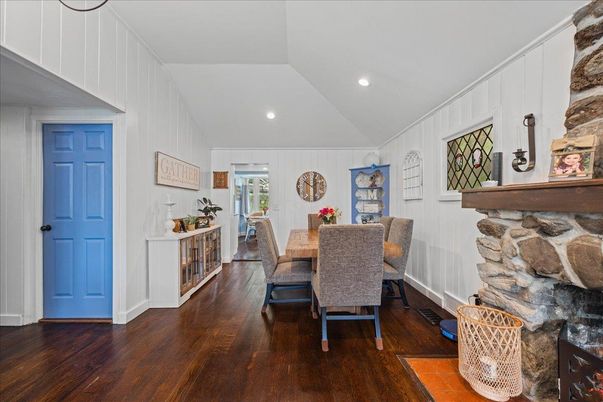 Dining room, Fireplace, Interior, Recessed Lighting, Stone Walls, Wood Texture Flooring