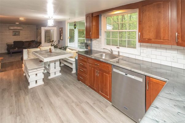 Dining room, Interior, Kitchen, Recessed Lighting, Stainless Steel Appliances, Stone Walls, Wood Texture Flooring