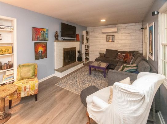Fireplace, Interior, Living room, Recessed Lighting, Stone Walls, Wood Texture Flooring
