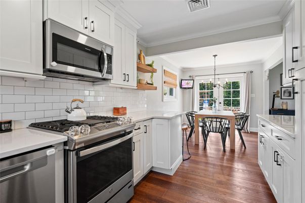 Dining room, Interior, Kitchen, Pendant Lights, Stainless Steel Appliances, Wood Texture Flooring
