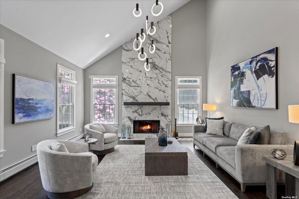 Fireplace, Interior, Living room, Marble Walls, Pendant Lights, Recessed Lighting, Wood Texture Flooring