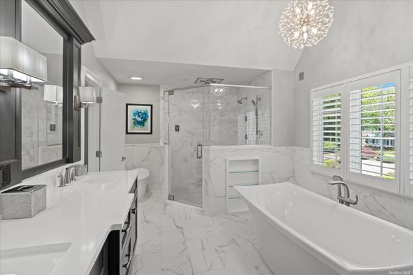 Bathroom, Chandelier, Dual Sink Vanities, Free Standing Baths, Glass Shower, Interior, Marble, Marble Walls, Recessed Lighting