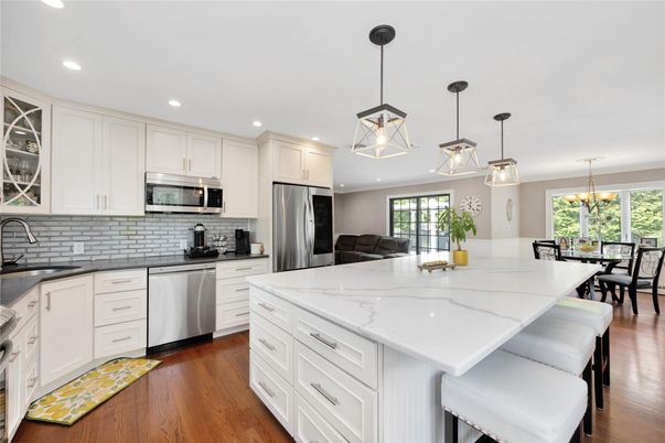 Chandelier, Dining room, Interior, Kitchen, Pendant Lights, Recessed Lighting, Stainless Steel Appliances, Wood Texture Flooring